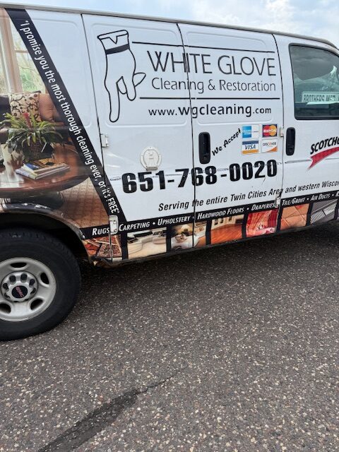 White Glove Cleaning & Restoration van featuring contact information and cleaning services offered